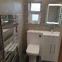 New bathroom with beige tiles